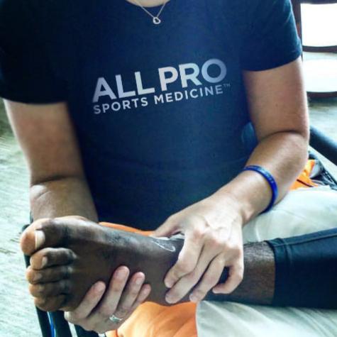 Joan Rubinger works on Kobe Bryant's left foot.